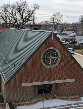 church with brand new metal roofing bourbon in