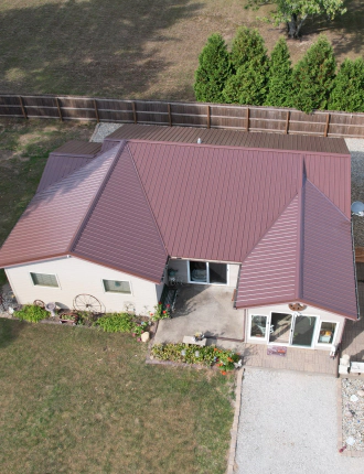 one story house with red metal roofing bourbon in